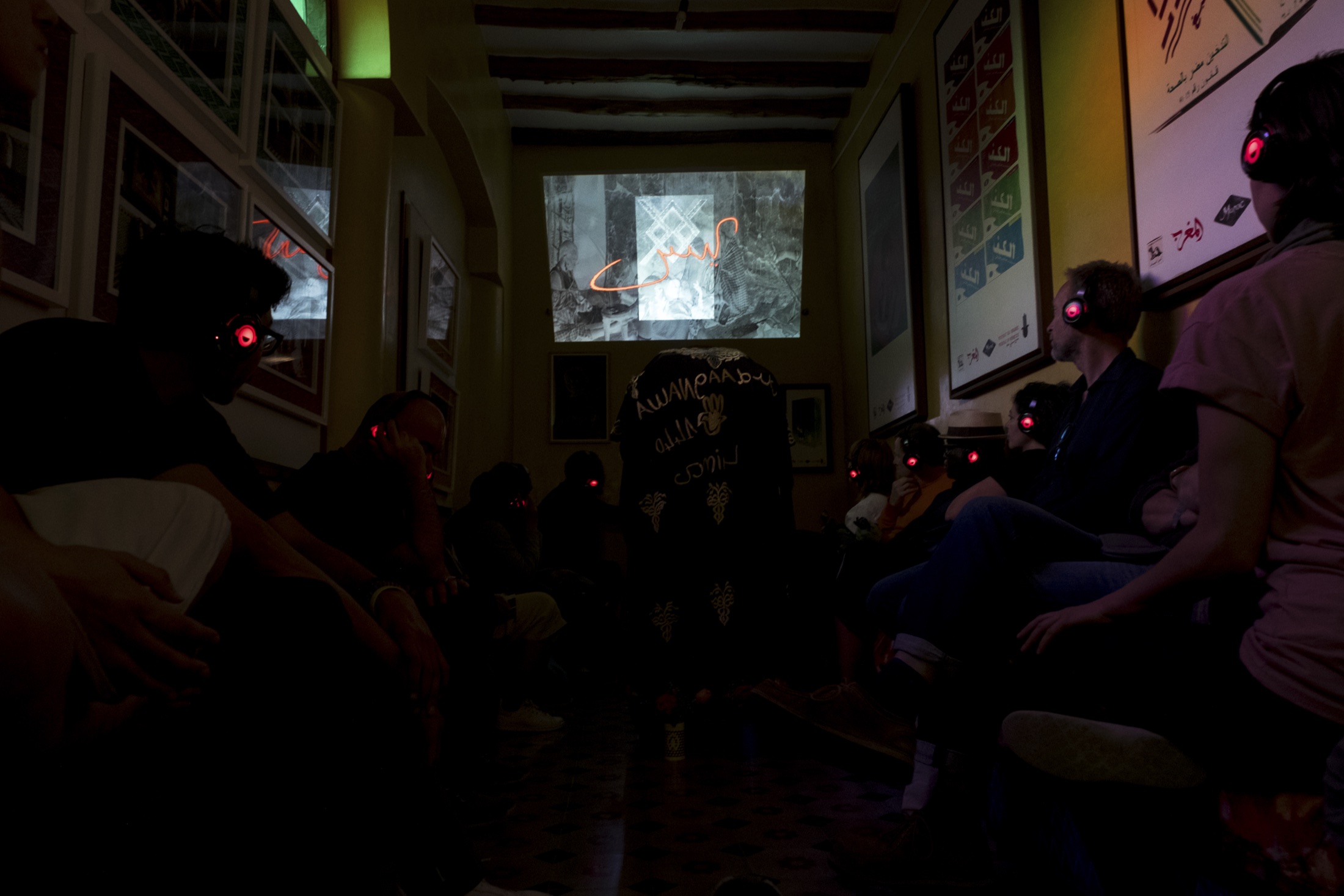 Audience wearing headphones inside the Marrakech Negus installation